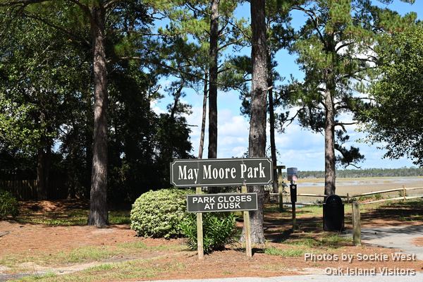 May Moore Park sign among the pines, Oak Island